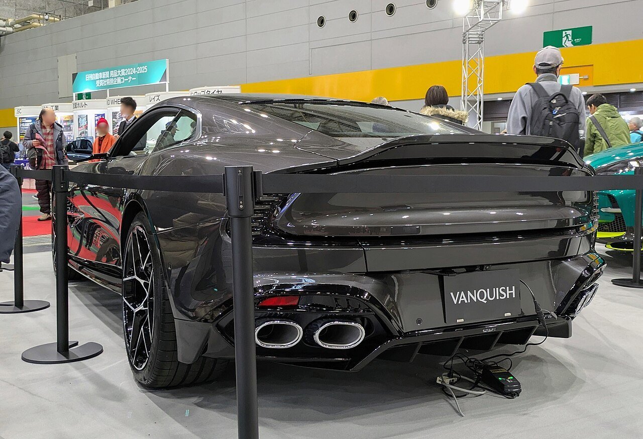 The same gray third-generation Aston Martin Vanquish coupe viewed from the rear at Japan Mobility Show Kansai 2025.
