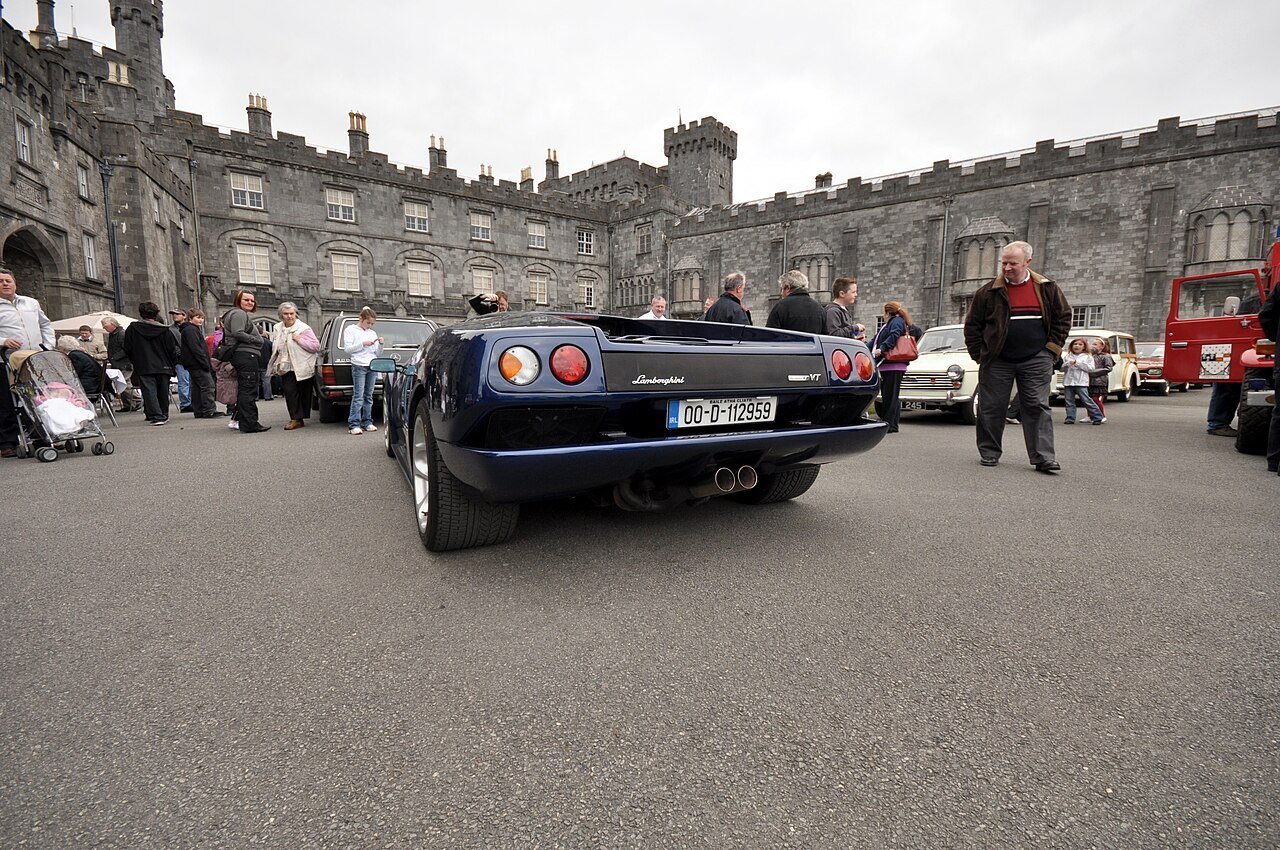 Dark blue Lamborghini Diablo VT 6.0 coupe viewed from behind at Kilkenny Castle.
