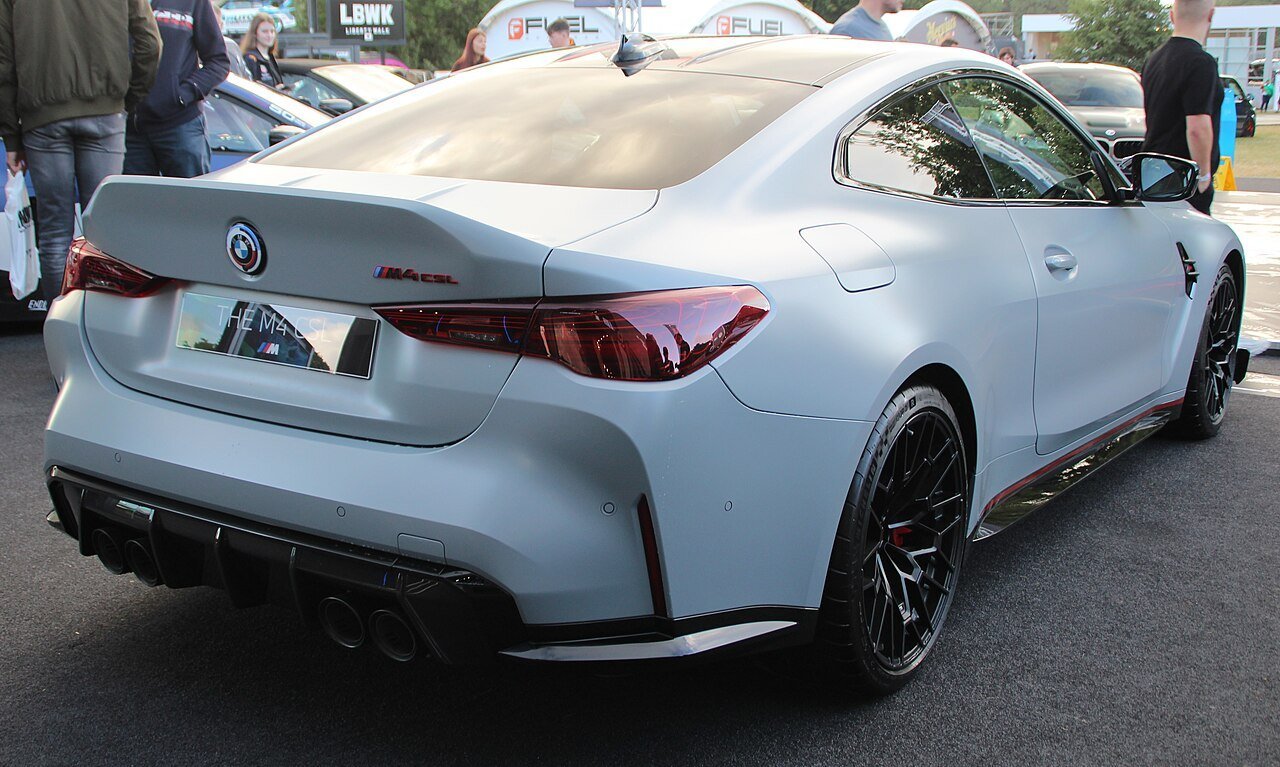 The same grey BMW M4 CSL G82 viewed from the rear-right at Goodwood in 2022.
