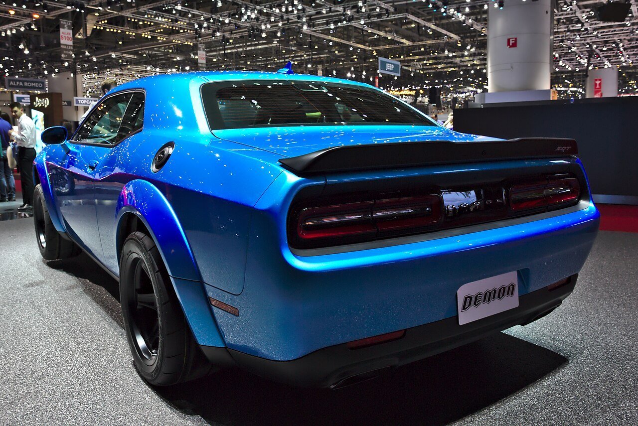 The same blue 2018 Dodge Challenger SRT Demon viewed from the rear-left at the Geneva motor show.