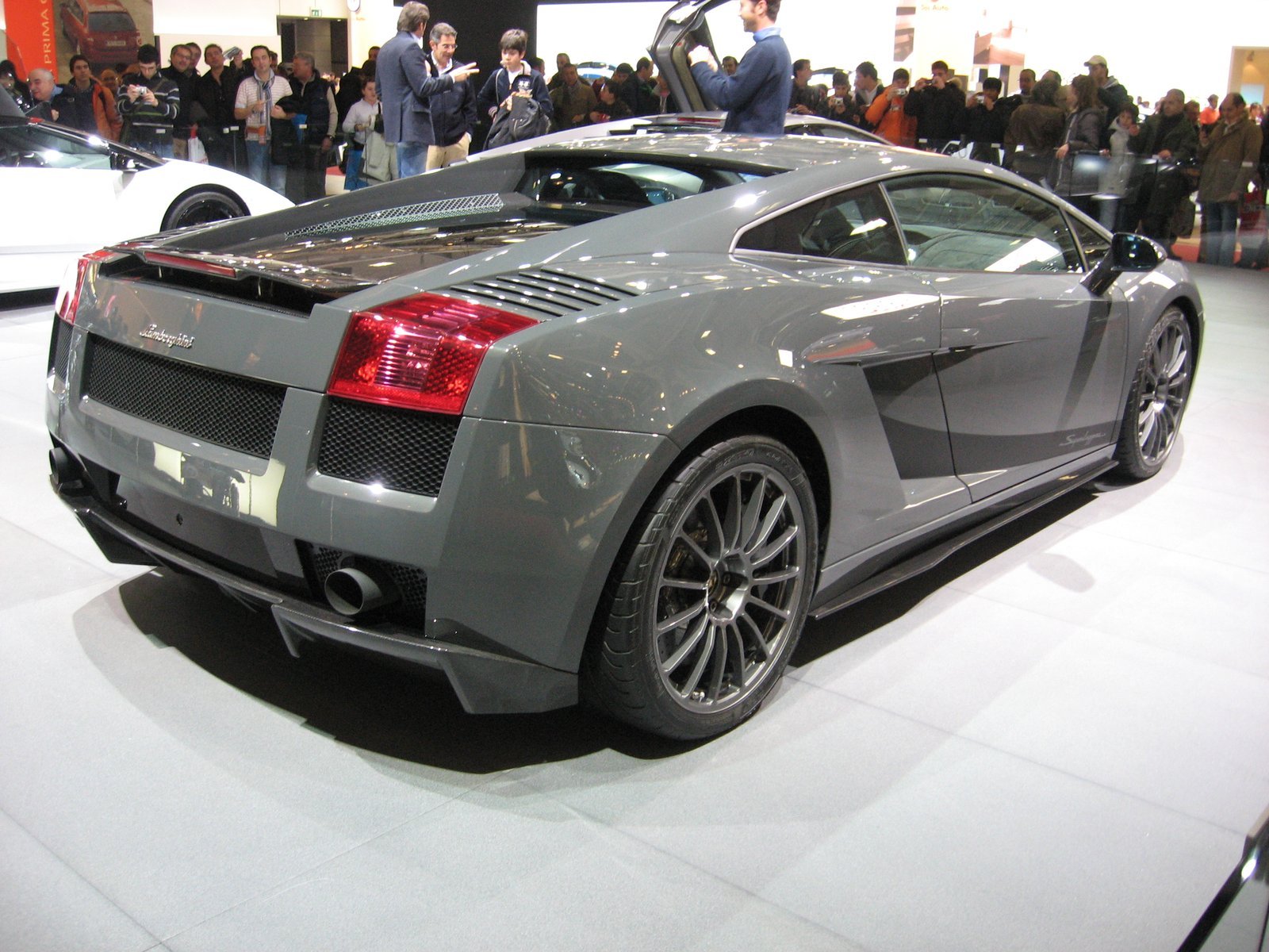 Grey original Gallardo Superleggera coupe photographed from the rear three-quarter angle at the Bologna motor show in 2007.